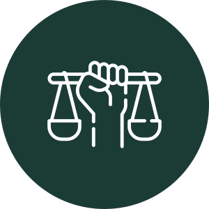A hand holding balanced scales symbolizing justice.