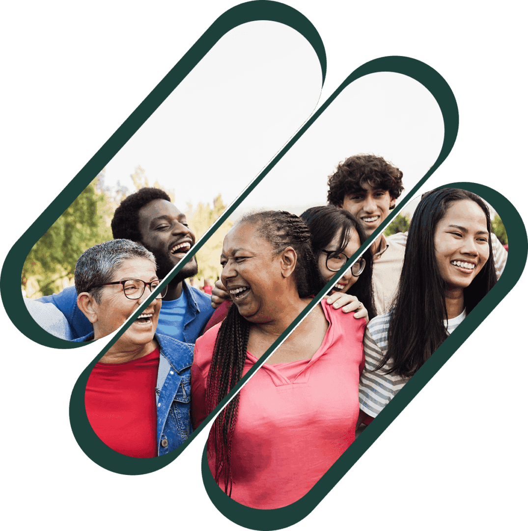 A diverse group of people smiling and enjoying outdoors together.