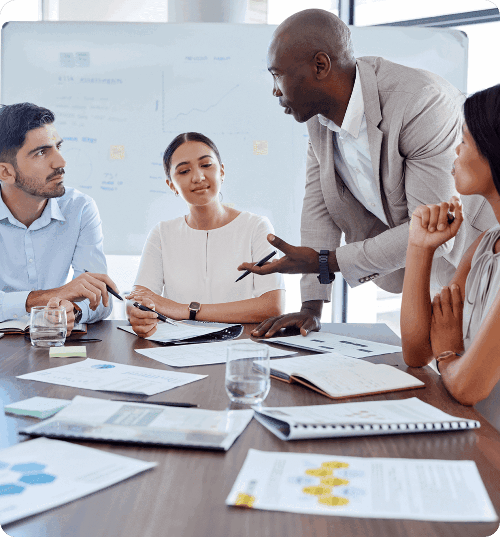 A business meeting with diverse colleagues discussing ideas around a table.